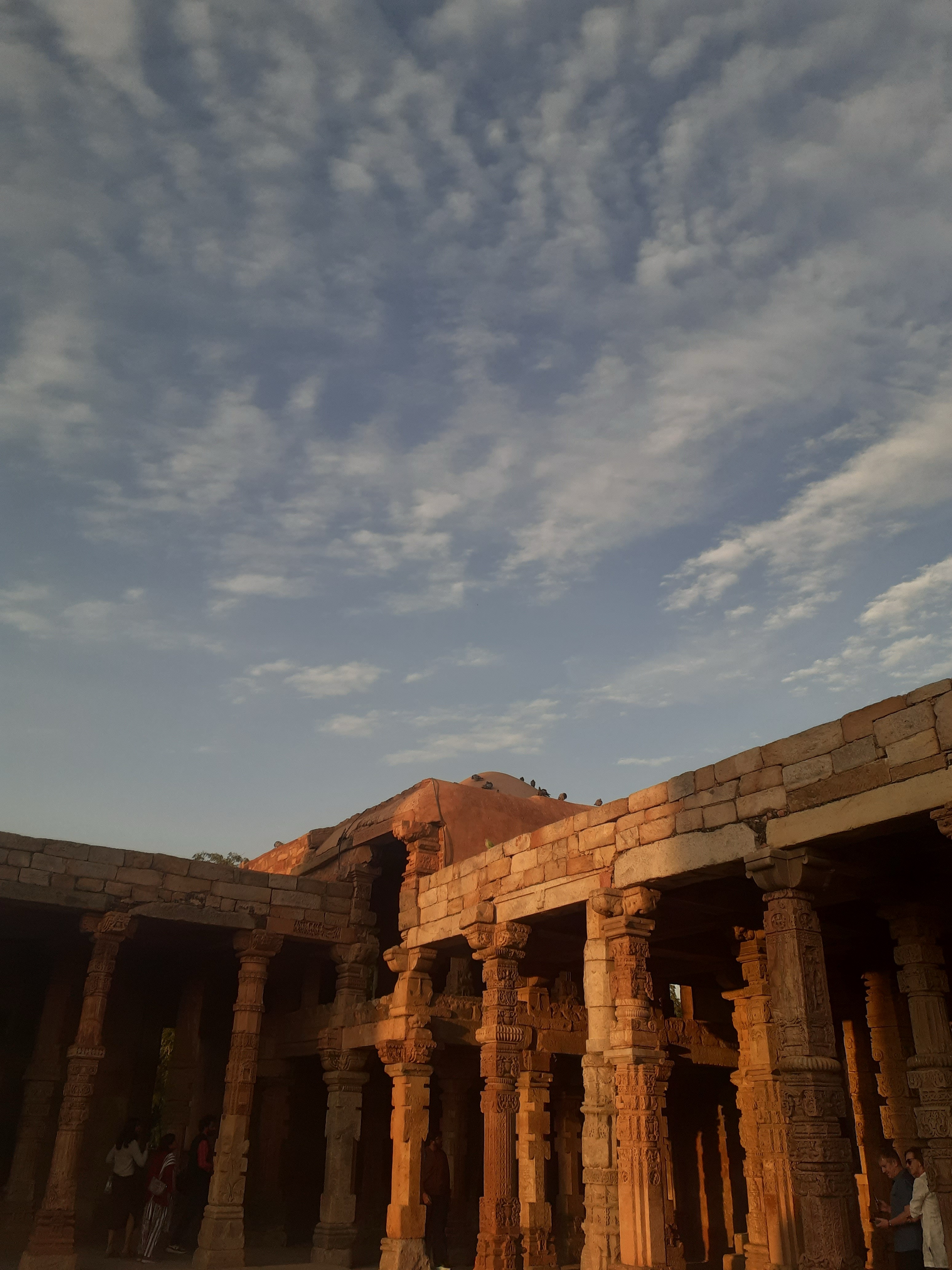 Intricately carved pillars at Qutub Minar complex